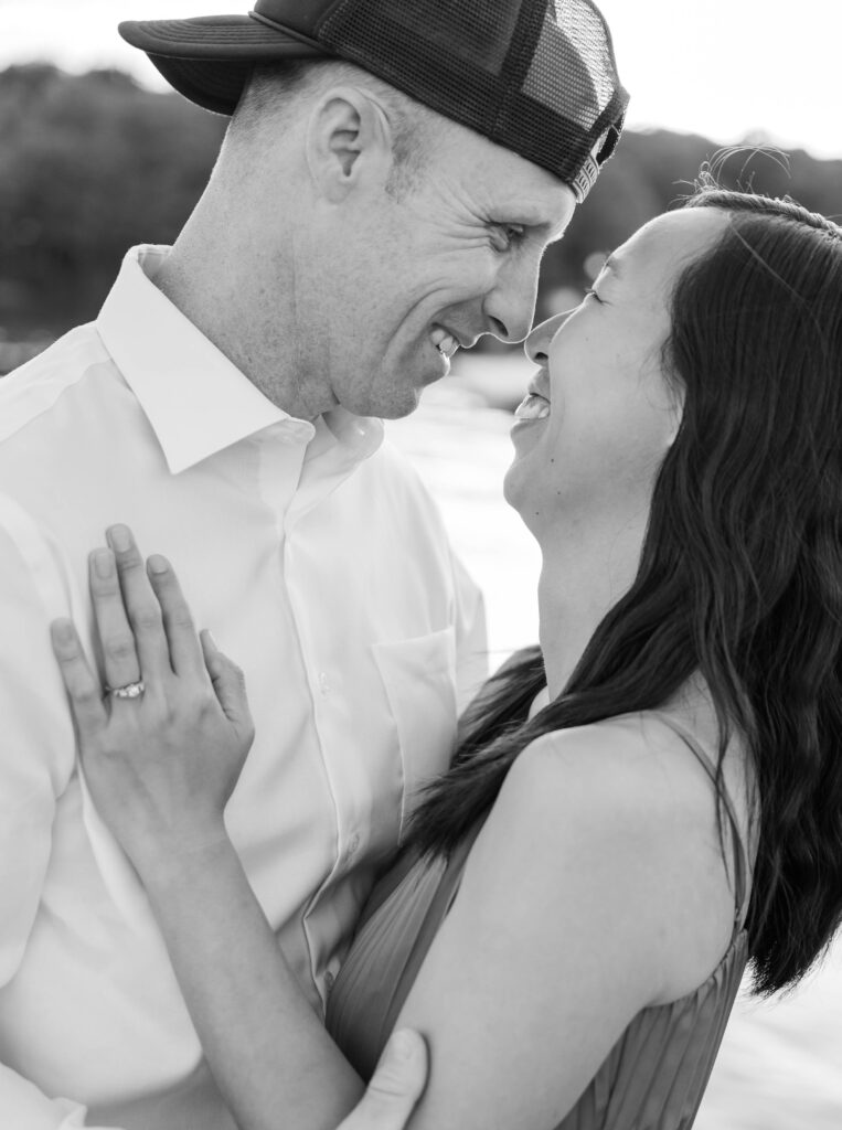 black and white photo of couple smiling nose to nose