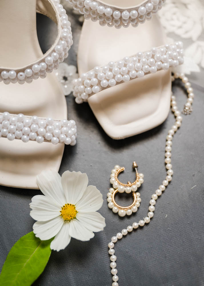 Pearl embellished high heels with pearl earrings and necklace