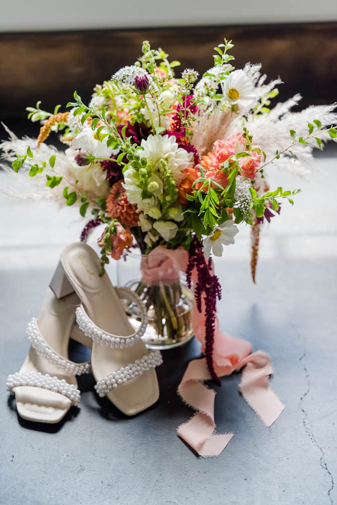 Bridal bouquet and brides pearl embellished shoes